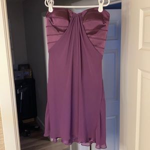 La Femme strapless eggplant mini dress with crossed detailing in the back